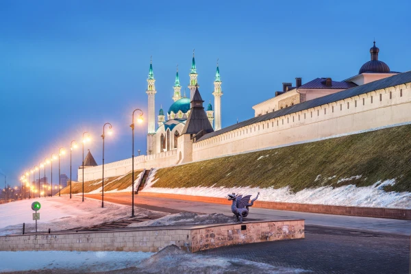 Winter evening at the walls of the Kazan Kremlin and the dragon Zilant