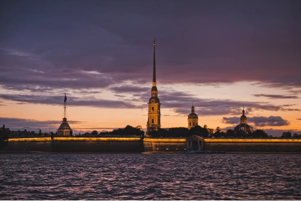 Night shooting from the motor ship during the White nights, a view of the Peter and Paul Fortress and the Cathedral sacred Peter and Pavel in the city of St. Petersburg.