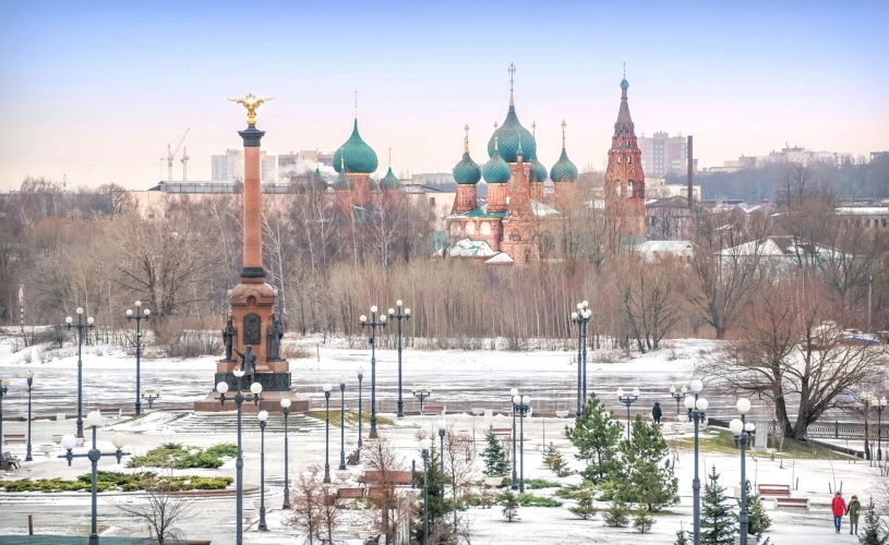 View of the 1000 Years Monument to Yaroslavl and the Temple complex in Korovniki from the Strelka Park in Yaroslavl on a winter cloudy day